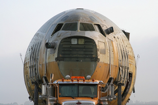 Illustration for article titled Boeing C-17 Fuselage Trucked Through Long Beach Streets In Dead Of Night